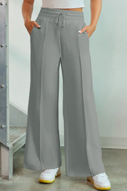 Heather gray palazzo joggers with center seam detail and drawstring waist.