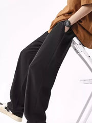 Men's black wide leg sweatpants with drawstring waist and pockets.