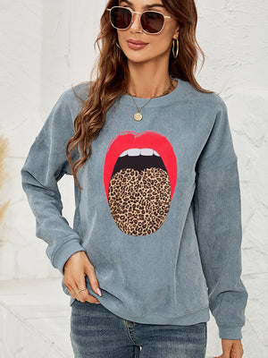 Corduroy crewneck sweatshirt in Deep Teal with a red lip and leopard print tongue graphic.