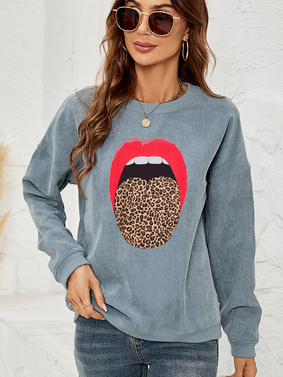 Corduroy crewneck sweatshirt in Deep Teal with a red lip and leopard print tongue graphic.