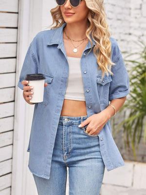 Relaxed light denim shirt jacket with cuffed short sleeves and buttoned chest pockets.