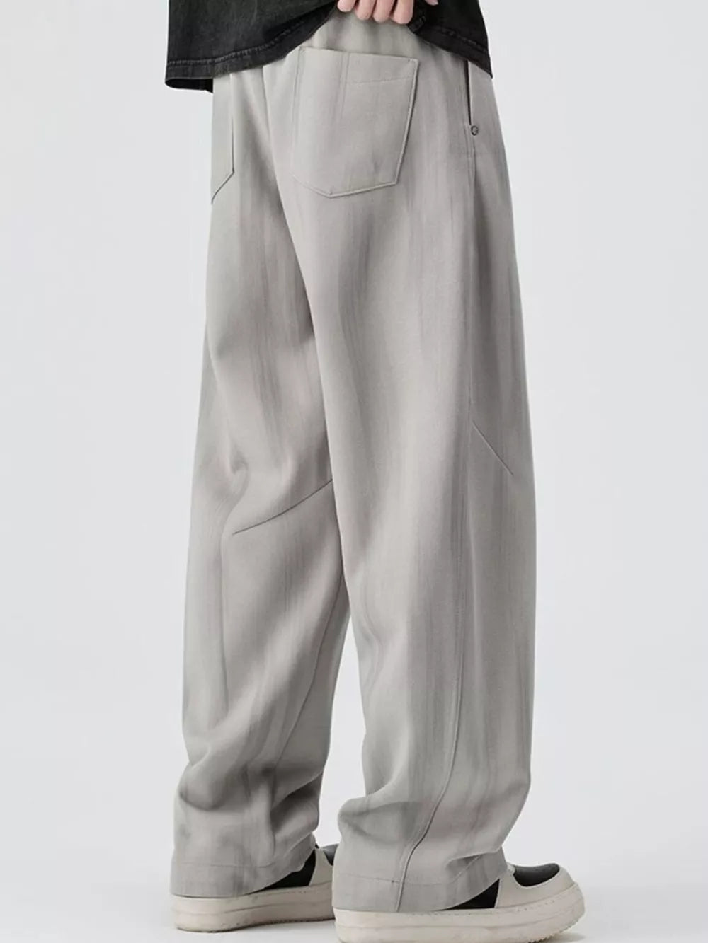 Light gray jogger pants with a drawstring and back pocket detail.