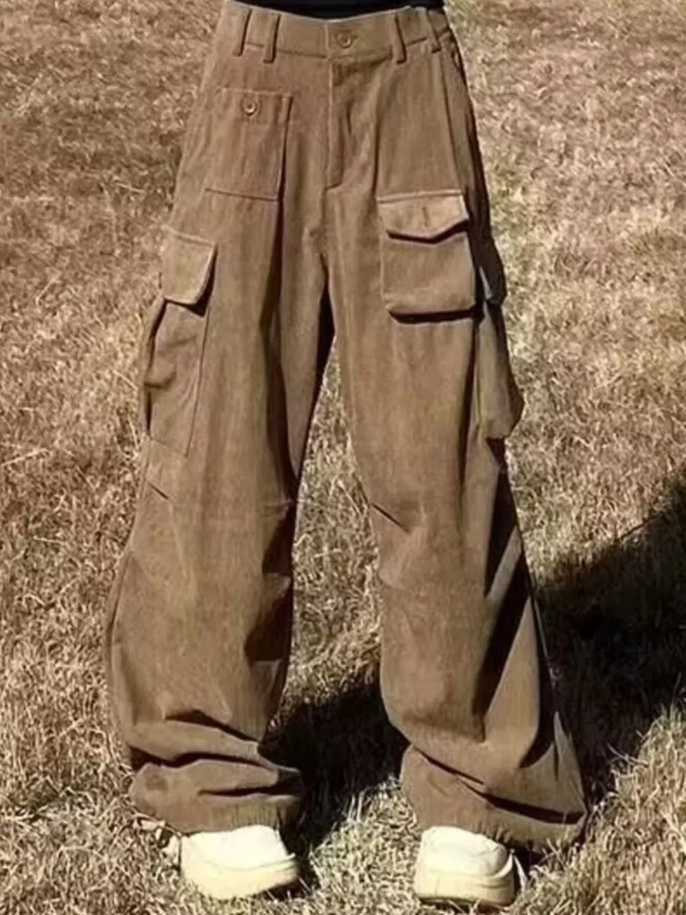 Brown ribbed cotton cargo joggers with spacious pockets and a relaxed fit.