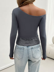Off-shoulder grey blouse with long sleeves and lace trim detail