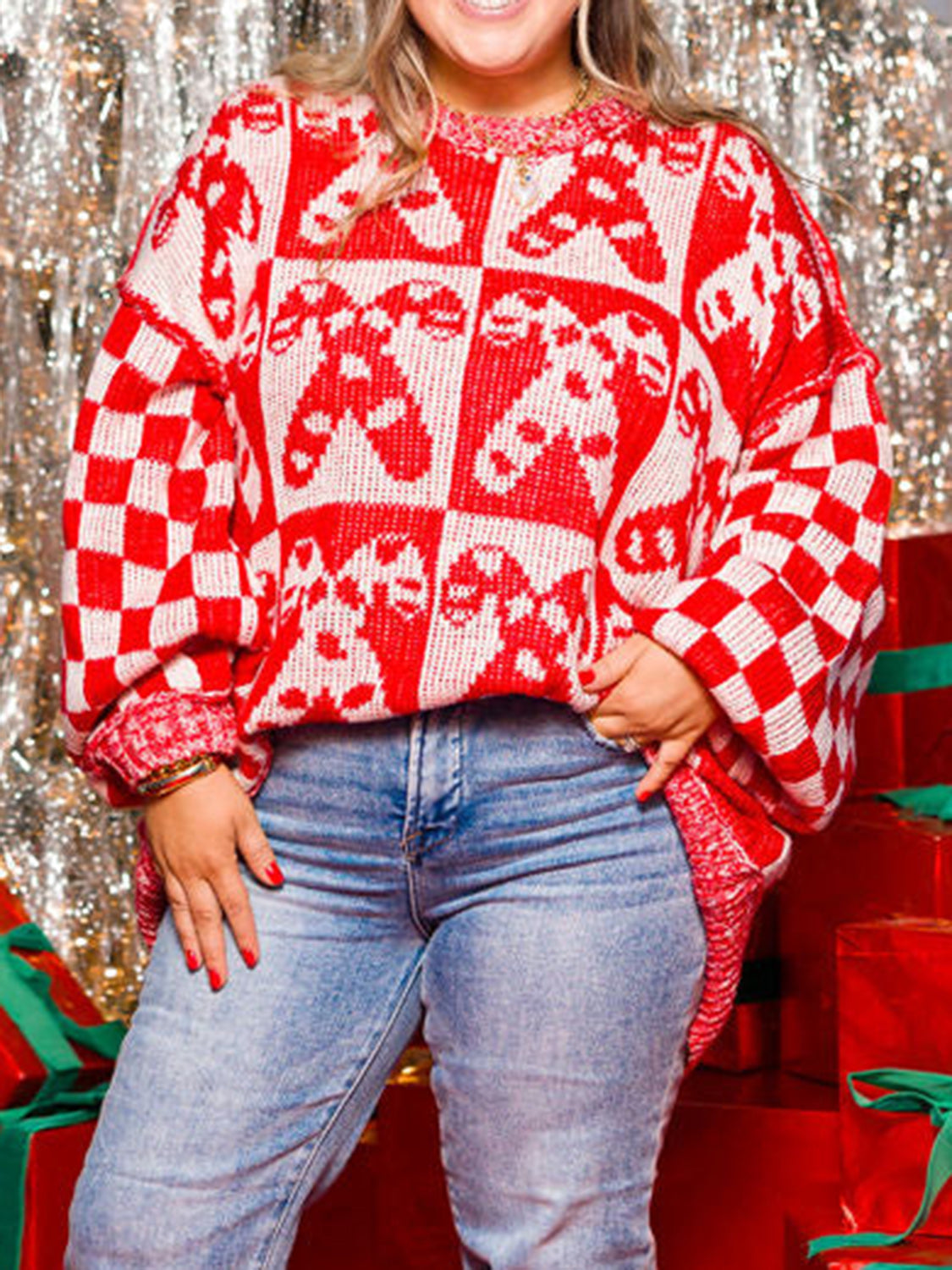 Checkerboard candy cane intarsia sweater in red and white acrylic with crew neck.