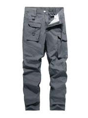Men's grey functional cargo pants with multiple pockets and zip fly.