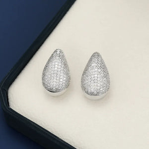 Pave teardrop stud earrings with gold base in silver.