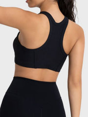 Black ribbed racerback crop top with contour stitching detail.