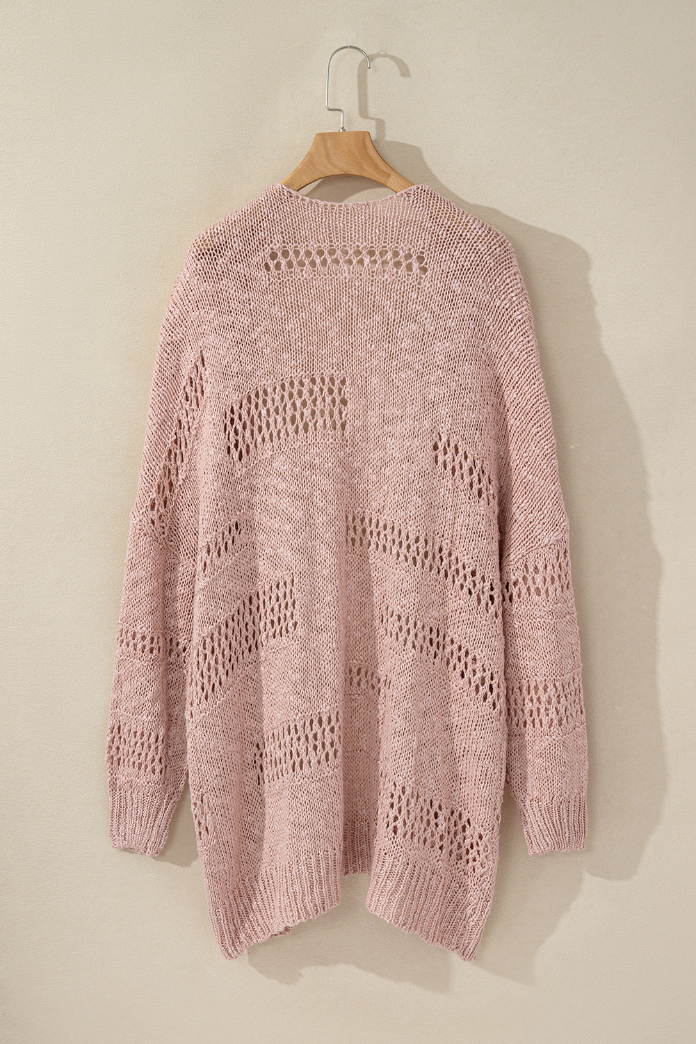 Dusty pink open-knit slouch cardigan with a relaxed fit and airy texture.