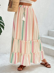 Chevron stripe tiered maxi skirt with drawstring waist and tassel detail in multicolor.