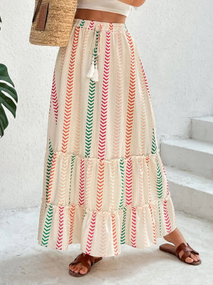 Chevron stripe tiered maxi skirt with drawstring waist and tassel detail in multicolor.