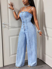 Light wash denim jumpsuit with button-down front and wide legs.