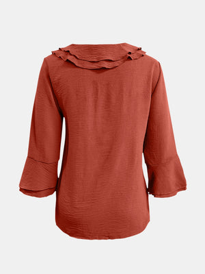 Orange-red linen blouse with ruffled neckline and flared 3/4 sleeves
