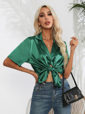 Dark green satin tie-front collared shirt with short sleeves and a knotted hem.