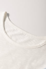 White embroidered tee with crew neck and flutter sleeves.