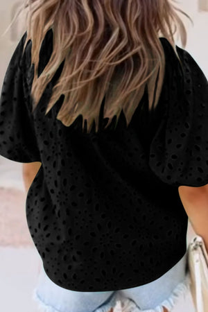 Black eyelet puff-sleeve blouse with stand collar and short sleeves.