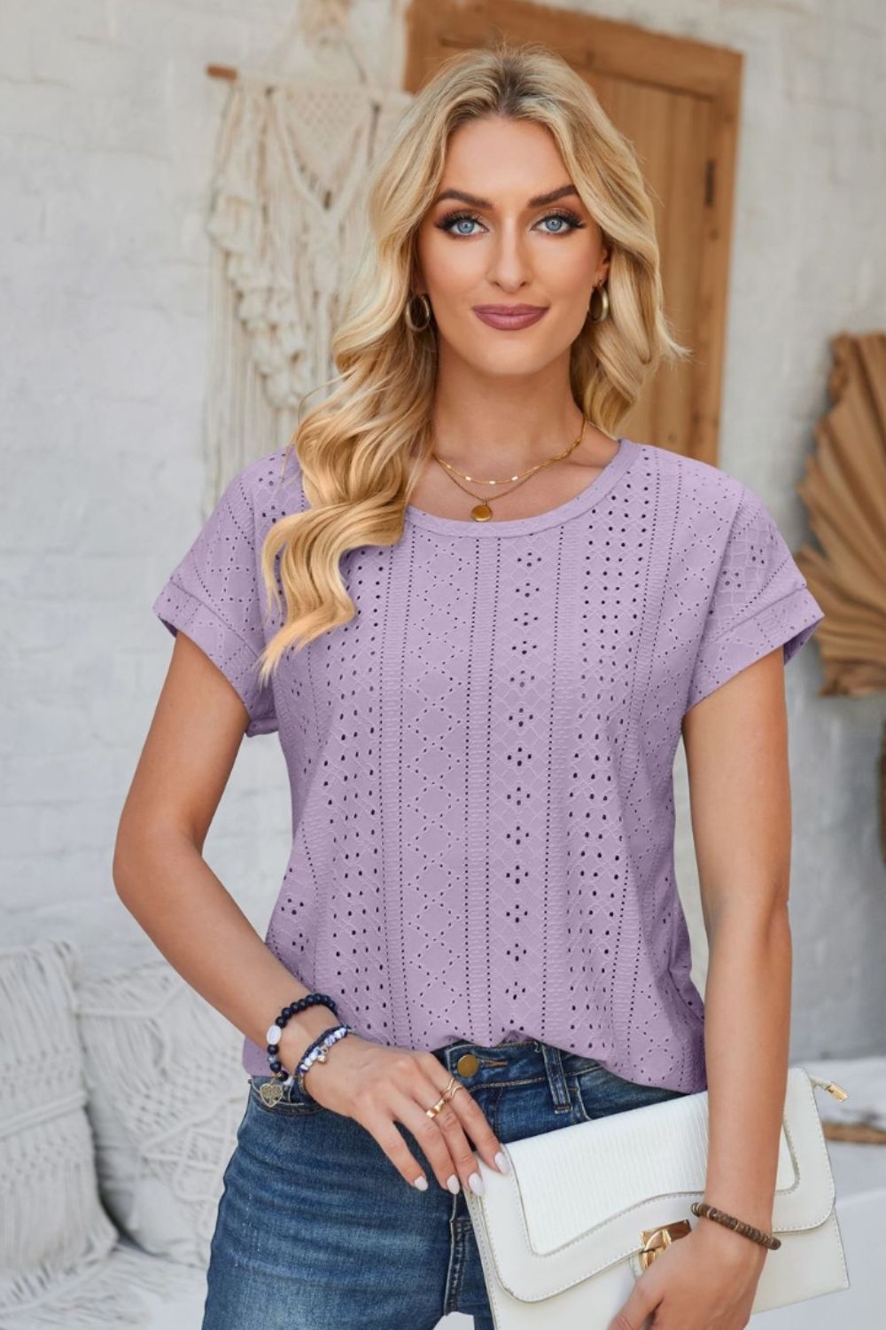 Lavender perforated eyelet cuffed tee with short sleeves and a round neckline.