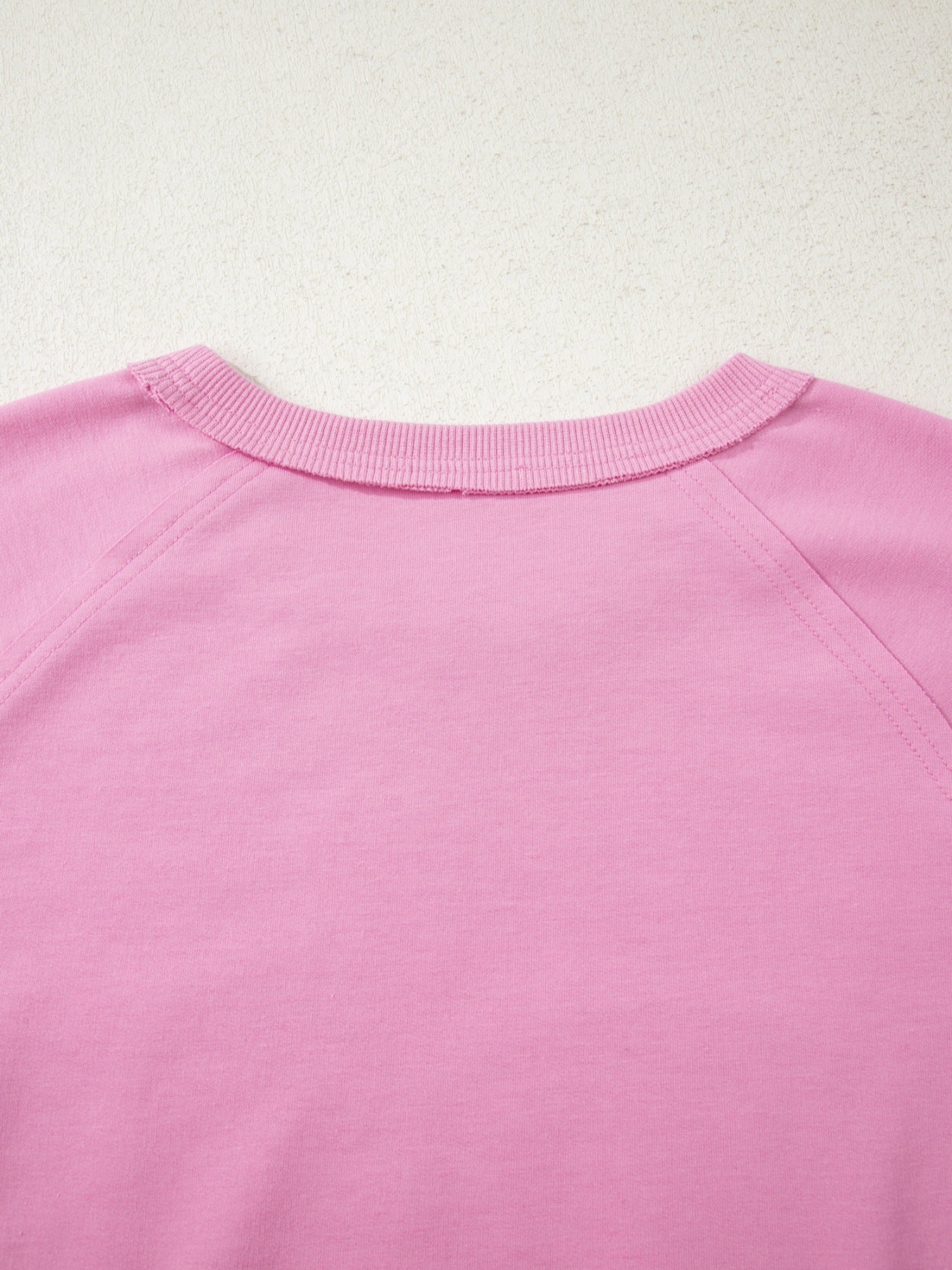Pink cotton crew-neck sweatshirt with embroidered heart detail