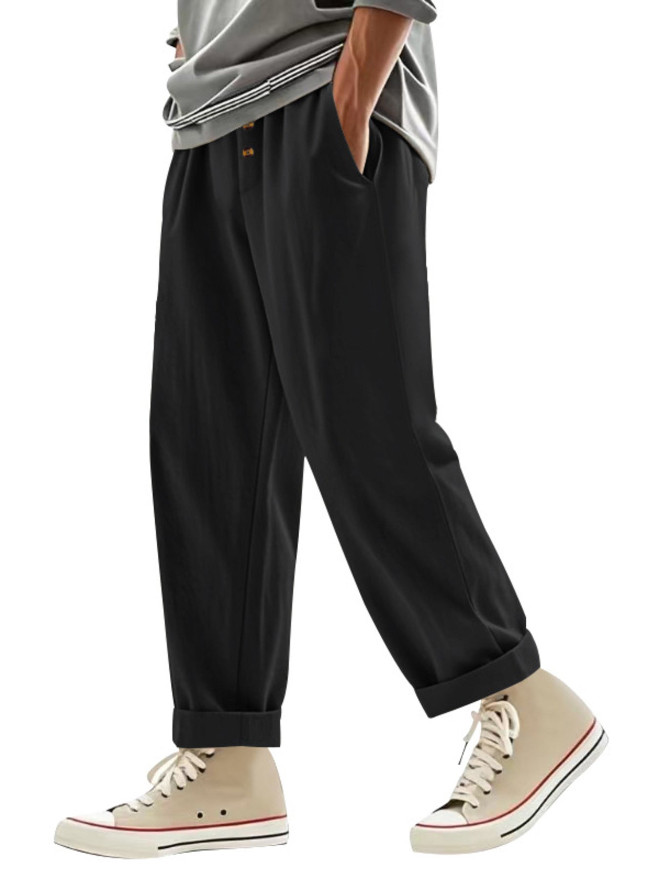 Men's black loose fit drawstring sweatpants with cuffed hems.