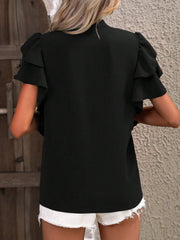 Black ruffled sleeve blouse with a plunge neckline, detailed view.