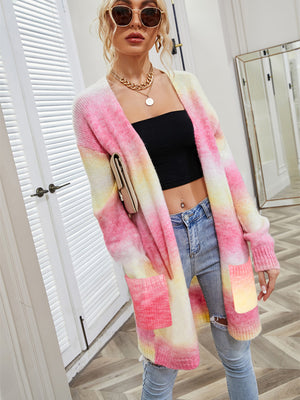Rainbow gradient knit cardigan with pockets, open front, long sleeves, and a relaxed fit.