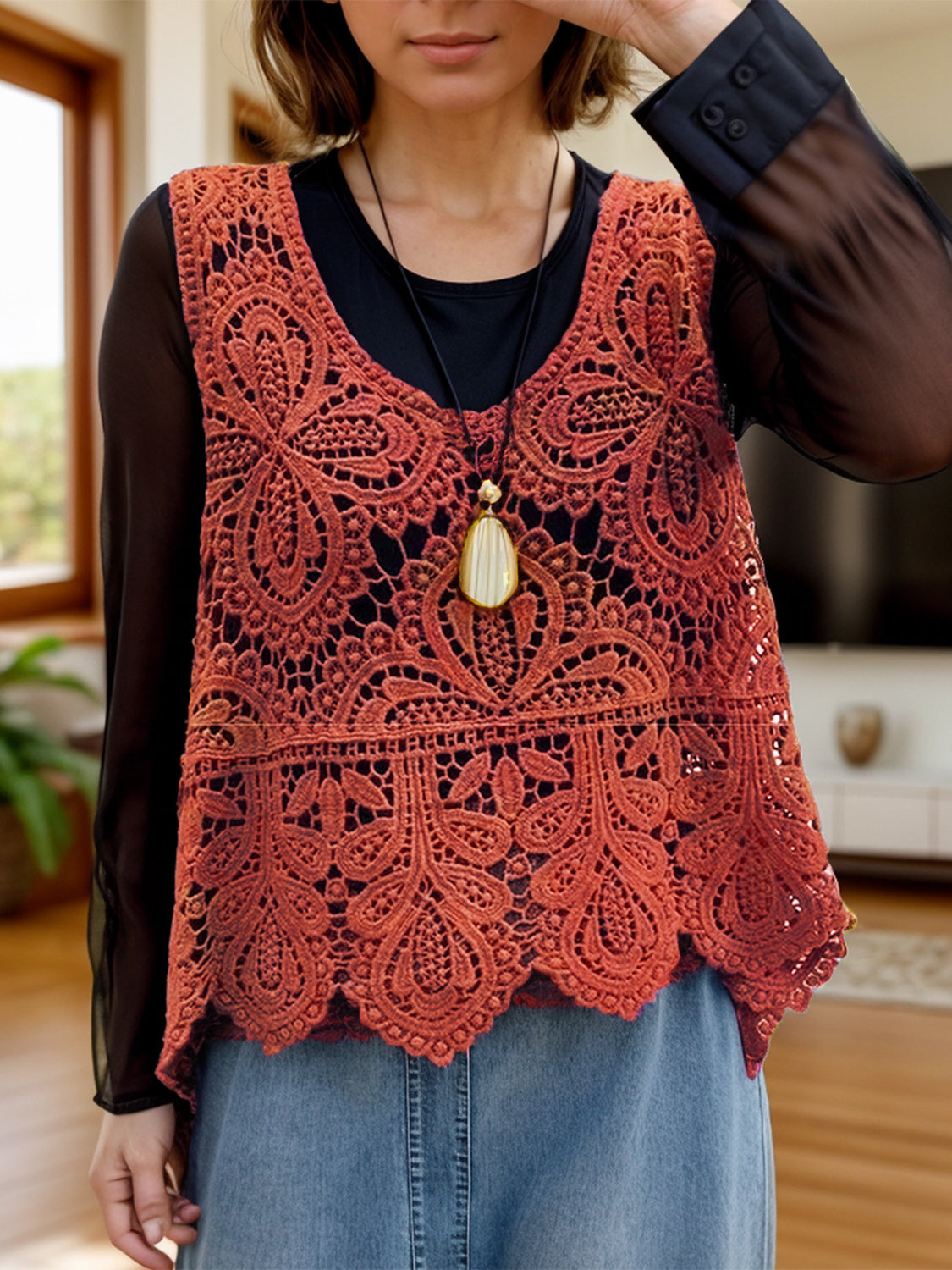 Terracotta lace overlay cropped vest with intricate floral pattern and scalloped hem.