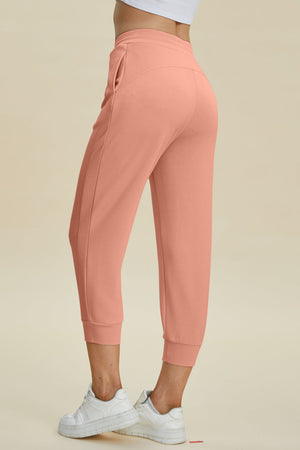 Coral joggers with drawstring waist and cuffed ankles.