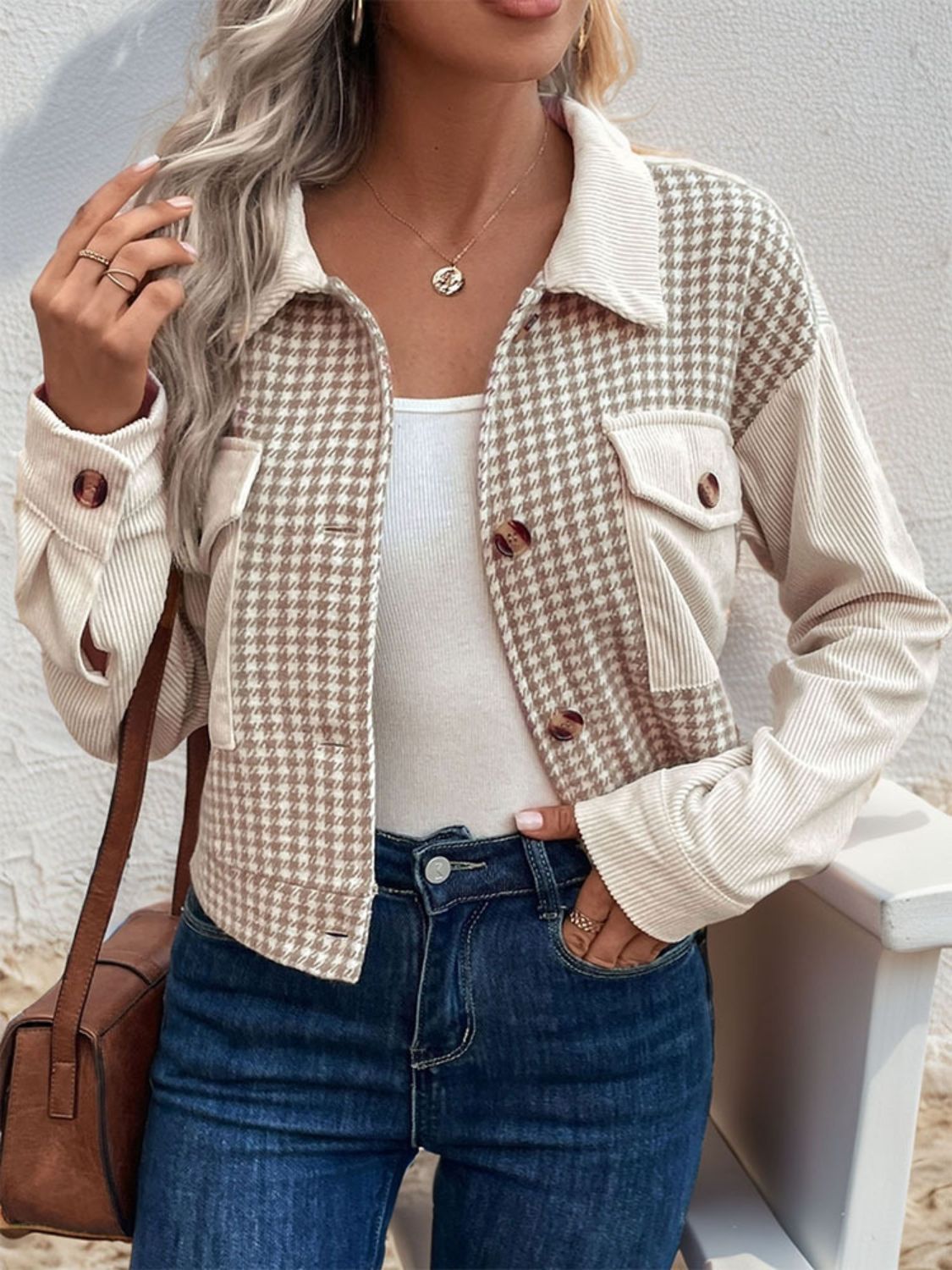 Beige houndstooth corduroy panel jacket with button front and chest pockets.