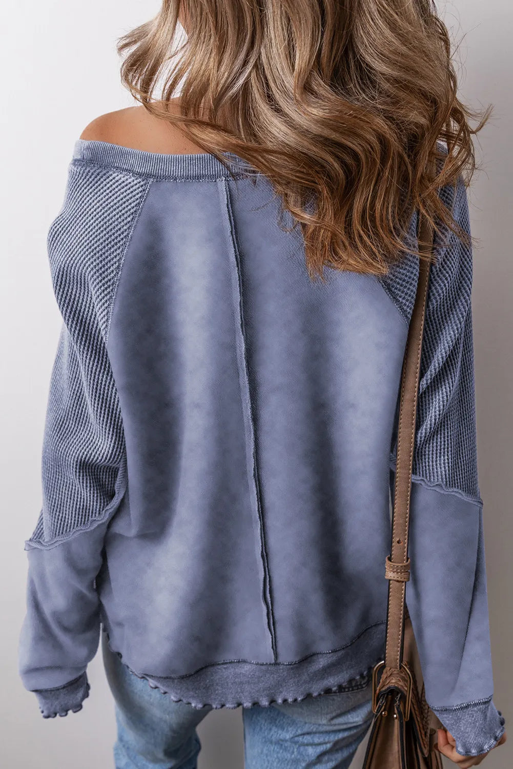 Dusty Blue waffle knit raglan sweatshirt with contrast sleeves and raw edge hem.