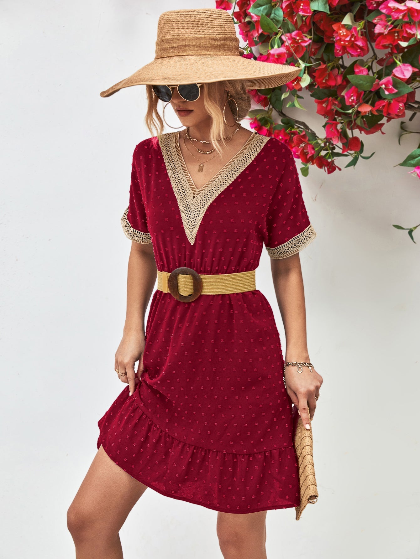 Burgundy Swiss dot dress with crochet trim and ruffle hem, V-neck, short sleeves.