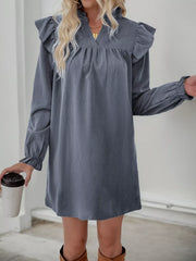 Dark gray cotton blend dress with ruffled notched sleeves and cinched cuffs.