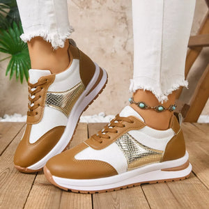 Chic lace-up sneakers in light brown and white with textured gold accents.