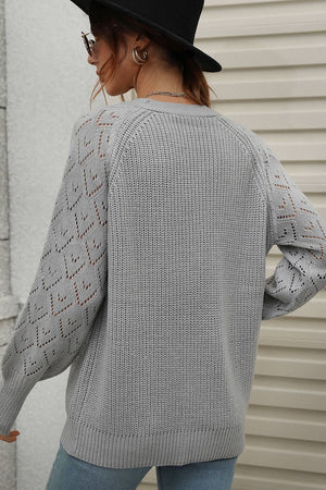 Gray acrylic diamond knit cardigan with openwork sleeves and crew neck.