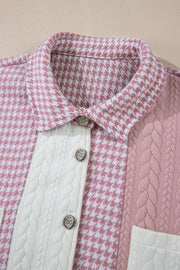 Panelled houndstooth shacket in dusty pink with quilted details and ornate buttons.