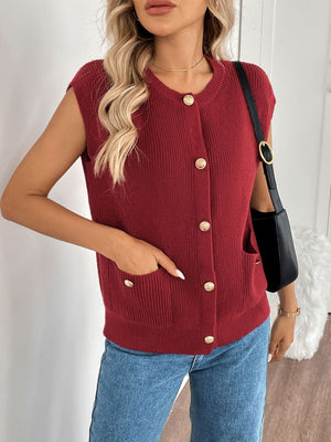 Ribbed knit vest in rust with gold buttons and pocket details.