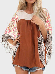 Textured panel blouse with floral and leopard print flutter sleeves.
