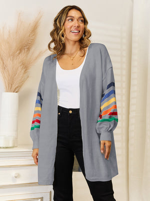 Gray knit open-front cardigan with rainbow stripe sleeves and balloon sleeves.