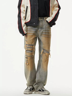 Men's distressed jeans with unique wash and ripped details