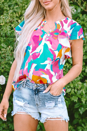 Abstract print ruffle sleeve blouse with smocked neckline and keyhole detail.