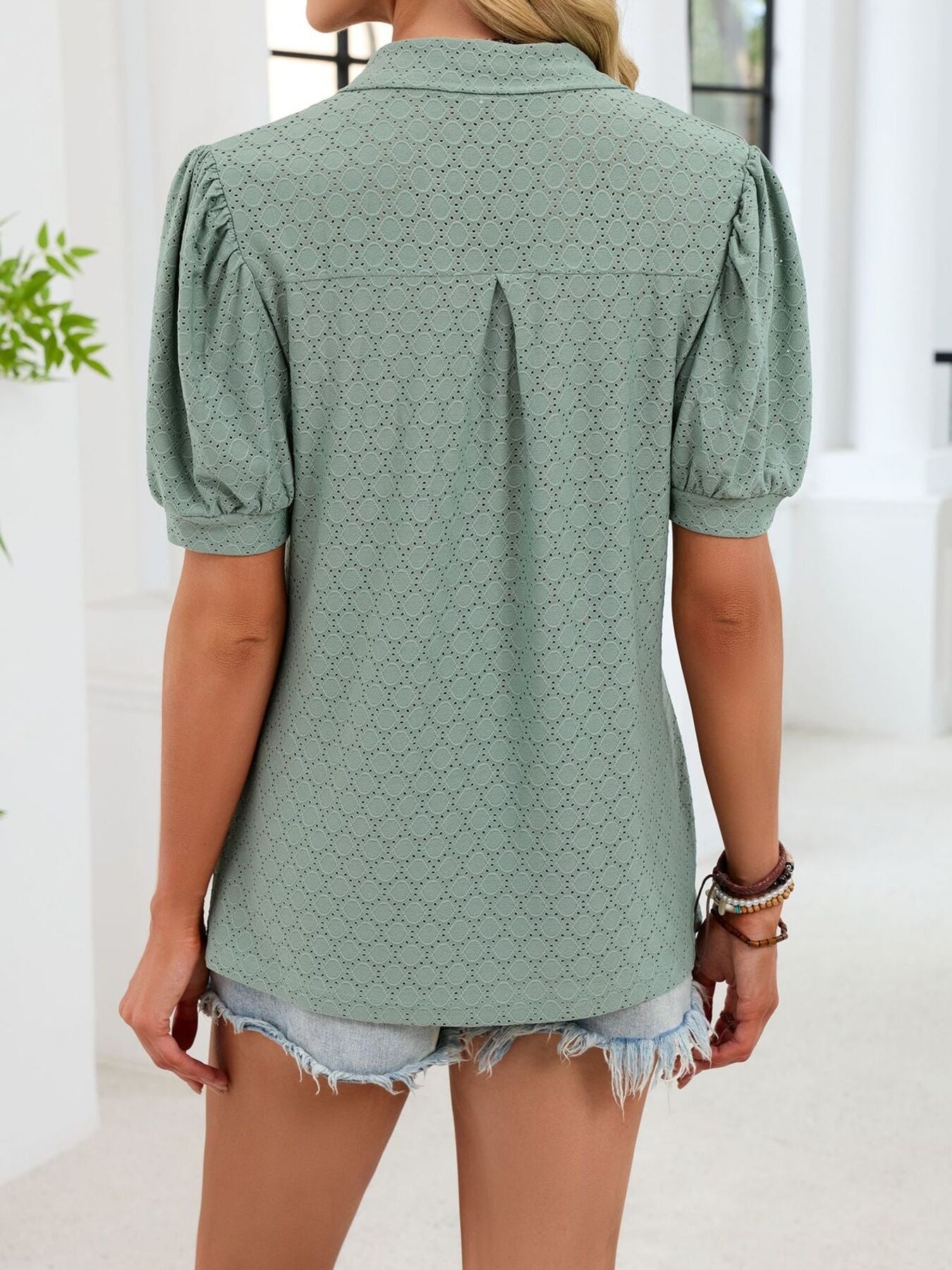 Green eyelet puff sleeve collar top with a diamond pattern.