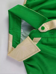 Green abstract print belted shirt dress with collared neckline and button details.
