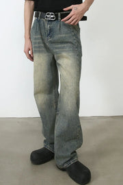 Faded wash baggy carpenter jeans in medium with a relaxed fit and distressed details.