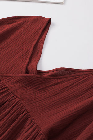 Textured gauze blouse in burnt coral with gathered detail and square neckline.