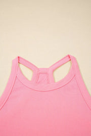 Dusty pink ribbed cropped tank top with racerback detail and contrast stitching.