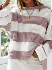 Striped oversized knit sweater in dusty pink and white with bell sleeves and a crew neck.