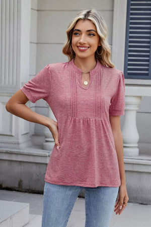 Dusty pink short sleeve blouse with pleated yoke and keyhole neckline