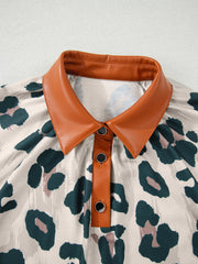 Print short sleeve blouse with faux leather collar and button placket, animal print pattern.