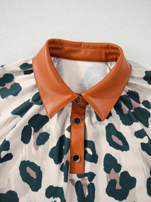 Print short sleeve blouse with faux leather collar and button placket, animal print pattern.
