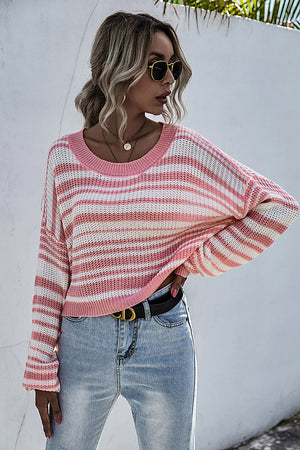 Cropped knit crew neck sweater with pink and white stripes, long sleeves.