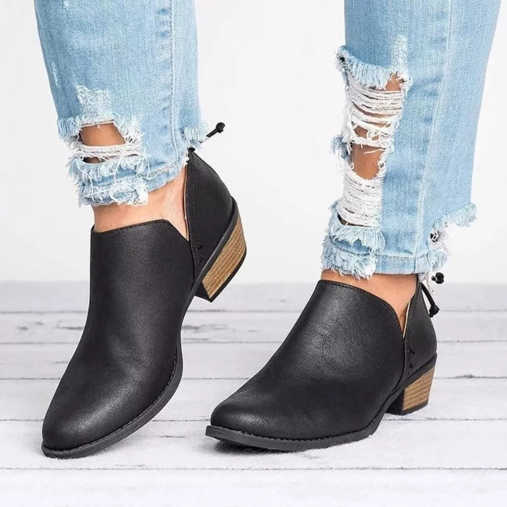 Black V-cut pointed toe block heel boots with a wooden heel detail.